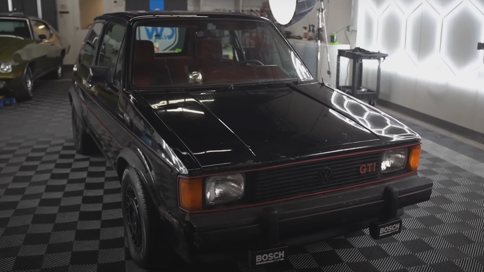 The 1983 Mk1 Volkswagen GTI showing a refreshed exterior after detailing