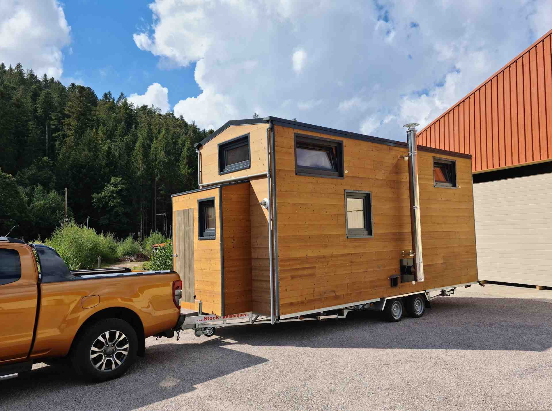 Bohemian French Tiny House with Dual-Loft Design